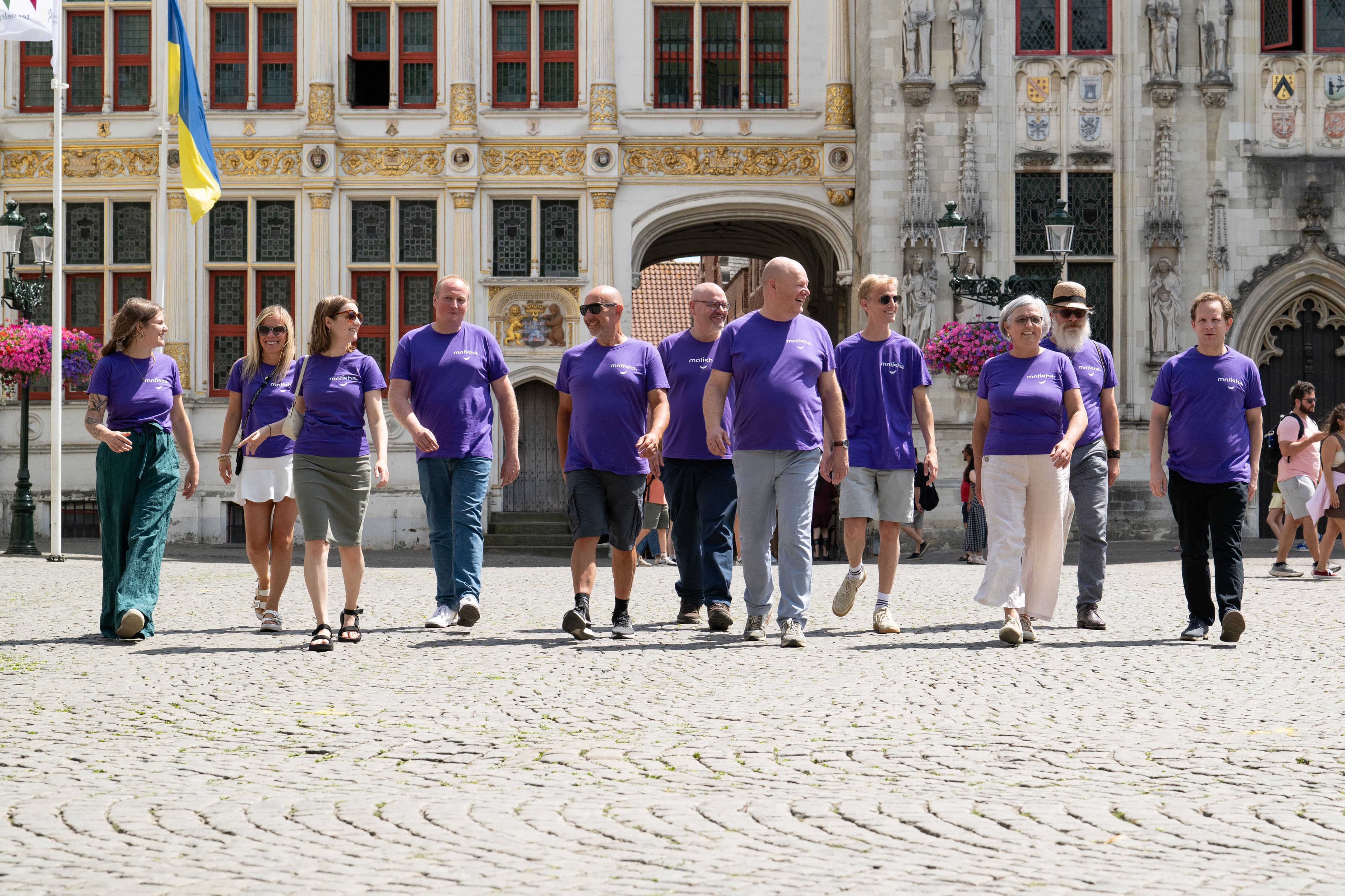 Motisha team walking through Bruges facing the camera